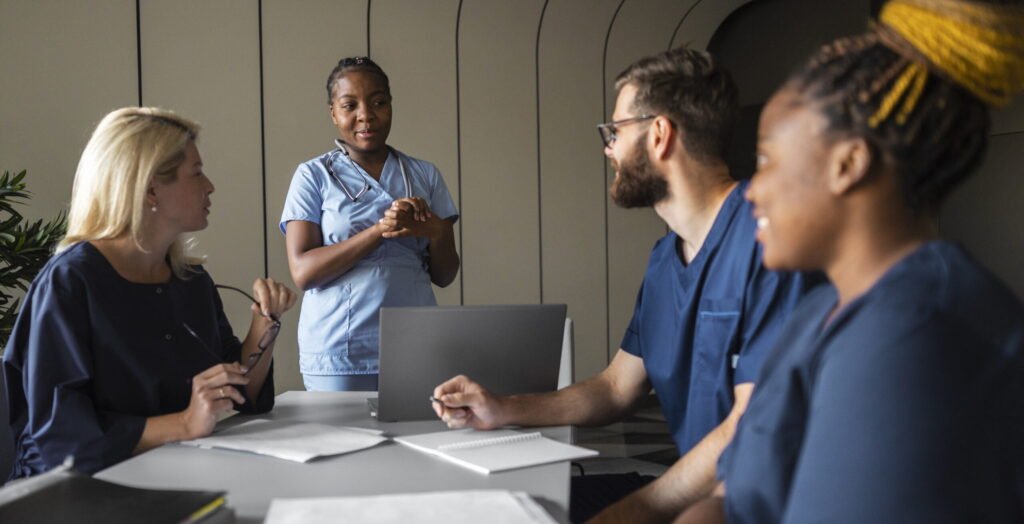 side view healthcare professionals meeting scaled e1723207812456